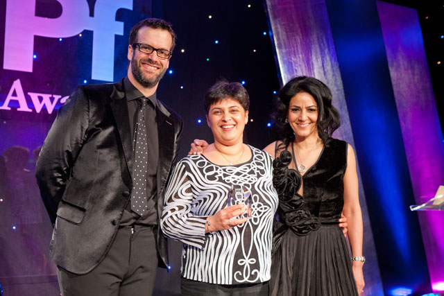 Seema is seen here being presented with her award by Marcus Brigstocke and Kavita Oberoi OBE